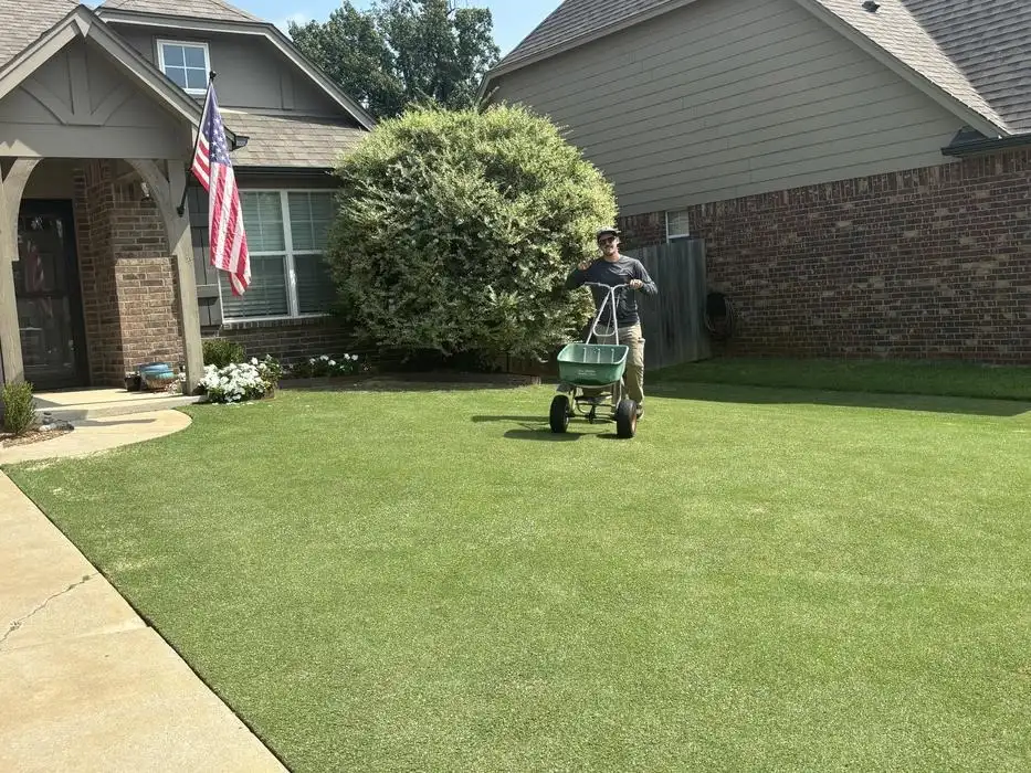Uniform color and density on a Broken Arrow front lawn from consistent nutrition and watering